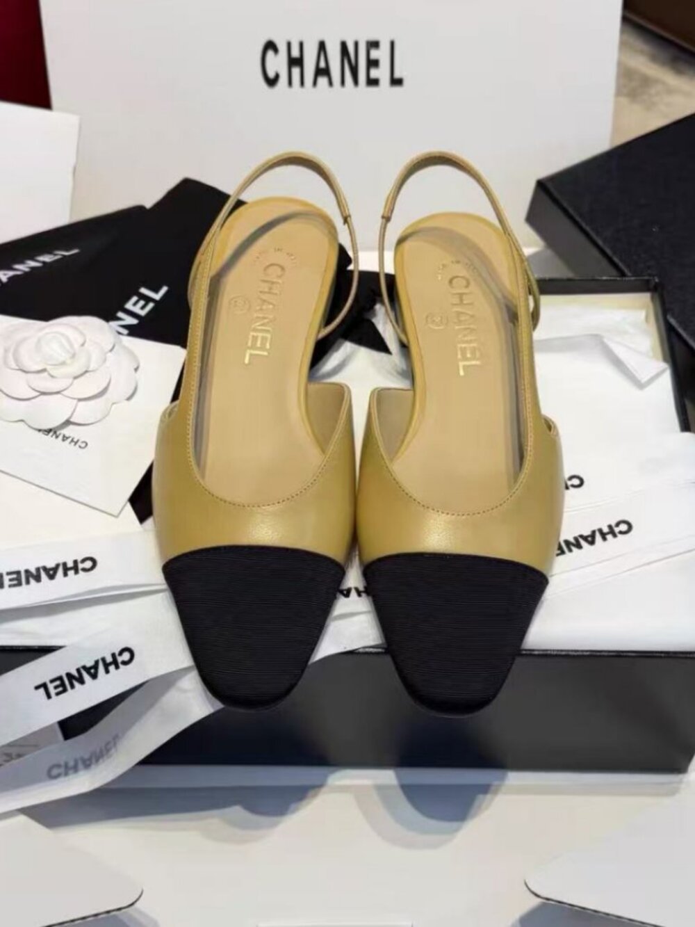 CHANEL Two‑Tone Beige Black Cap‑Toe Slingback Flat Sandals
